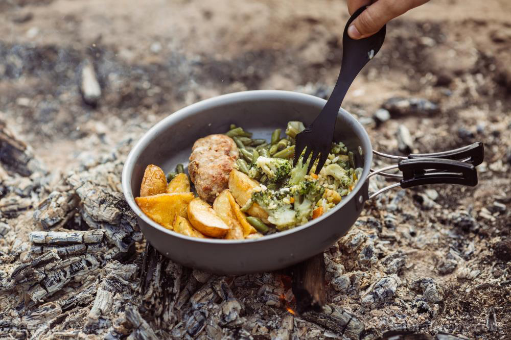 Here’s how to cook over an open fire for camping or emergencies (recipes included)